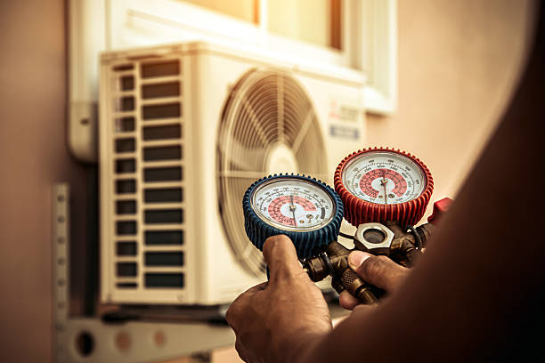 Professional Hvac Installation technician working in Gravette, AR